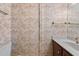 Small bathroom with floral wallpaper, vanity, sink, and lighting at 128 Pine Cone Trl, Ormond Beach, FL 32174