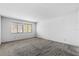 Spacious bedroom featuring two bright windows and neutral carpeting at 128 Pine Cone Trl, Ormond Beach, FL 32174