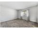 Bright bedroom with carpeted floors and view of the outdoors at 128 Pine Cone Trl, Ormond Beach, FL 32174