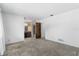 Neutral bedroom with bathroom visible and textured carpet at 128 Pine Cone Trl, Ormond Beach, FL 32174