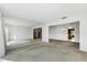 Spacious living room with mirrored wall, carpet and light fixtures at 128 Pine Cone Trl, Ormond Beach, FL 32174