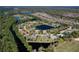 Aerial view of a home on a cul-de-sac surrounded by a tranquil pond in a community and golf course at 1432 Kinnard Cir, Ormond Beach, FL 32174