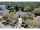 Aerial view highlighting the home's setting amongst mature trees and landscaping in an established neighborhood at 1432 Kinnard Cir, Ormond Beach, FL 32174