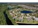 Aerial view of a home near a serene waterway with lush green landscapes at 1432 Kinnard Cir, Ormond Beach, FL 32174