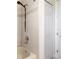 Bright bathroom features a shower over tub with tile surround and sleek fixtures at 1432 Kinnard Cir, Ormond Beach, FL 32174