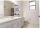 Bathroom featuring white cabinets, single sink vanity, toilet and a shower with curtains at 1432 Kinnard Cir, Ormond Beach, FL 32174