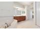 Bright bathroom featuring a soaking tub, vanity with double sinks, and tile flooring at 1432 Kinnard Cir, Ormond Beach, FL 32174
