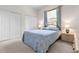 Cozy bedroom with a queen bed, bedside tables, lamps, and a window with natural light at 1432 Kinnard Cir, Ormond Beach, FL 32174