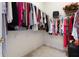 Walk-in closet with plenty of storage space and shelves, with carpet flooring at 1432 Kinnard Cir, Ormond Beach, FL 32174