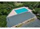 Aerial shot showcasing a sparkling community pool equipped with lounge chairs for relaxation at 1432 Kinnard Cir, Ormond Beach, FL 32174