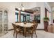 Bright dining area featuring tile floors, large mirror and wicker furniture at 1432 Kinnard Cir, Ormond Beach, FL 32174