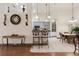 Open dining area with tile floor, elegant chairs, and views to the kitchen and breakfast nook at 1432 Kinnard Cir, Ormond Beach, FL 32174