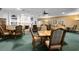 Elegant dining room with a fireplace, built-in bookshelves, and comfortable seating at 1432 Kinnard Cir, Ormond Beach, FL 32174