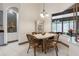 Dining room boasts a bright window and a display case with a built-in niche at 1432 Kinnard Cir, Ormond Beach, FL 32174