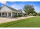 Beautiful clubhouse featuring an inviting walkway and well manicured landscaping at 1432 Kinnard Cir, Ormond Beach, FL 32174