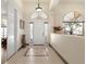 Inviting foyer featuring high ceilings, tile flooring, and archways at 1432 Kinnard Cir, Ormond Beach, FL 32174