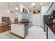 Kitchen with bar seating, gray cabinets, tile floors, stainless steel appliances, and eat-in kitchen at 1432 Kinnard Cir, Ormond Beach, FL 32174