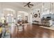 Open-concept living room with hardwood floors, archways, and neutral decor at 1432 Kinnard Cir, Ormond Beach, FL 32174