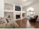 Cozy living room featuring a fireplace and plenty of natural light at 1432 Kinnard Cir, Ormond Beach, FL 32174