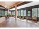 Bright sunroom with tile flooring, dark trim and lots of windows at 1432 Kinnard Cir, Ormond Beach, FL 32174