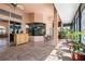 The bright sunroom has tile floors, multiple windows, tropical ceiling fans and a wet bar at 1432 Kinnard Cir, Ormond Beach, FL 32174