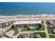 Stunning aerial view of oceanfront condos featuring private parking, community pool and access to the beach at 2600 Ocean Shore Blvd # 103, Ormond Beach, FL 32176