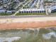 Aerial view of condo near the beach offers luxurious coastal living with an amazing ocean view and waves at 2600 Ocean Shore Blvd # 103, Ormond Beach, FL 32176