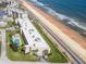 Oceanfront complex with a private pool and manicured lawns, offering direct beach access at 2600 Ocean Shore Blvd # 103, Ormond Beach, FL 32176