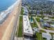 Aerial view of oceanfront condos with a shared pool and easy beach access at 2600 Ocean Shore Blvd # 103, Ormond Beach, FL 32176
