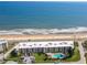 Aerial view of an oceanfront condo community with a swimming pool and access to the beach at 2600 Ocean Shore Blvd # 103, Ormond Beach, FL 32176
