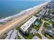 Aerial view of oceanfront condos featuring convenient parking, community pool and easy beach access at 2600 Ocean Shore Blvd # 103, Ormond Beach, FL 32176