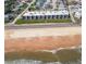 Aerial view of condo near the beach offers luxurious coastal living with an amazing ocean view and waves at 2600 Ocean Shore Blvd # 103, Ormond Beach, FL 32176
