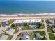 Aerial view of an oceanfront condo community with a community pool and direct access to the beach at 2600 Ocean Shore Blvd # 103, Ormond Beach, FL 32176