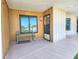 Charming condo entrance with bench seating and well-lit access, featuring a 'Relax' sign at 2600 Ocean Shore Blvd # 103, Ormond Beach, FL 32176