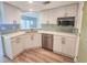 Modern kitchen features stainless steel appliances, a peninsula with a breakfast bar, and ample storage at 2600 Ocean Shore Blvd # 103, Ormond Beach, FL 32176