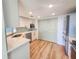 Bright kitchen features stainless steel appliances, white cabinets, and modern countertops at 2600 Ocean Shore Blvd # 103, Ormond Beach, FL 32176