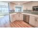 Well-lit kitchen features stainless steel appliances and a breakfast bar overlooking the ocean at 2600 Ocean Shore Blvd # 103, Ormond Beach, FL 32176