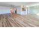 Spacious open-concept living area featuring updated flooring and an open view to the kitchen at 2600 Ocean Shore Blvd # 103, Ormond Beach, FL 32176