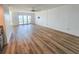 Spacious living room with laminate floors and sliding glass doors at 2600 Ocean Shore Blvd # 103, Ormond Beach, FL 32176
