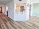 Bright living space with laminate floors and an eat in kitchen area at 2600 Ocean Shore Blvd # 103, Ormond Beach, FL 32176