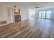 Open concept living room with wet bar and large windows with a water view at 2600 Ocean Shore Blvd # 103, Ormond Beach, FL 32176