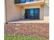 Patio with sliding glass door entrance and exterior landscaping at 2600 Ocean Shore Blvd # 103, Ormond Beach, FL 32176