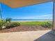 Patio with a view of the beach and manicured landscaping at 2600 Ocean Shore Blvd # 103, Ormond Beach, FL 32176