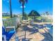Poolside table and chairs offer a great space to gather with Gathering and friends to enjoy the Florida sunshine at 2600 Ocean Shore Blvd # 103, Ormond Beach, FL 32176