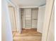 Well-organized walk-in closet with built-in shelving and ample hanging space at 2600 Ocean Shore Blvd # 103, Ormond Beach, FL 32176