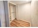 Spacious walk-in closet with adjustable shelving and wood-look flooring at 2600 Ocean Shore Blvd # 103, Ormond Beach, FL 32176