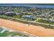 Aerial view of coastal community with beach access, showcasing residential neighborhood at 3390 Ocean Shore Blvd # 4020, Ormond Beach, FL 32176