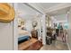 Hallway leading to bedroom featuring wood floors, elegant decor, and lots of natural light at 3390 Ocean Shore Blvd # 4020, Ormond Beach, FL 32176