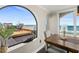 Bright dining area with water views and access to the outdoor deck with seating at 3390 Ocean Shore Blvd # 4020, Ormond Beach, FL 32176