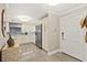 A well-lit kitchen features white cabinetry, stainless appliances, and a tiled backsplash at 3390 Ocean Shore Blvd # 4020, Ormond Beach, FL 32176